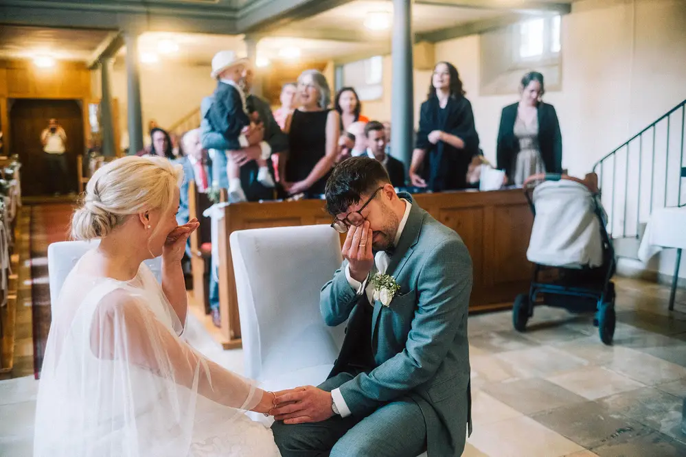 Church wedding in Baden-Württemberg near Heilbronn. Couple breaks into tears of joy. Leica M10 M11. Tiffen Black Pro Mist.