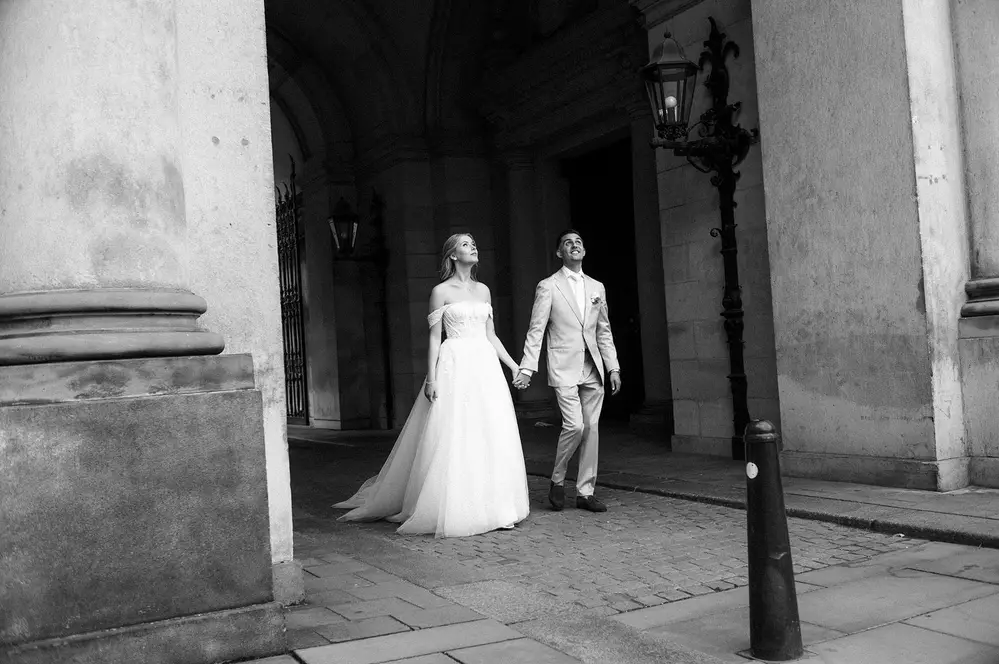 Wedding photo shoot in Hamburg at the City Hall, couple showing emotion. Leica M10 M11.