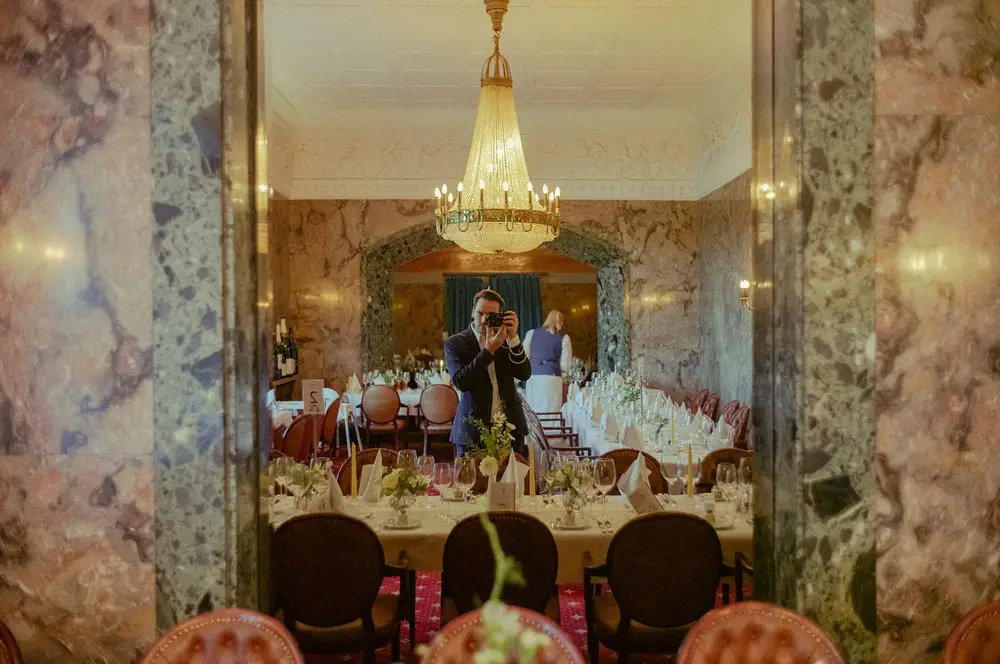 Wedding reception at the Anglo German Club in Hamburg on the Alster. Under a giant chandelier. Leica M10 M11.